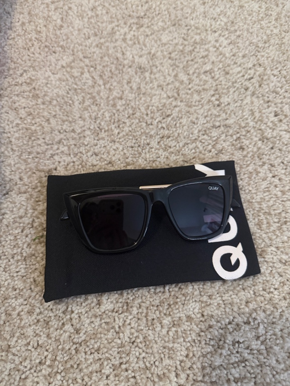 Quay Australia Glossy Black Sunglasses with Gold Accents